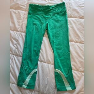 Lululemon Athletica green leggings with pale yellow accents
